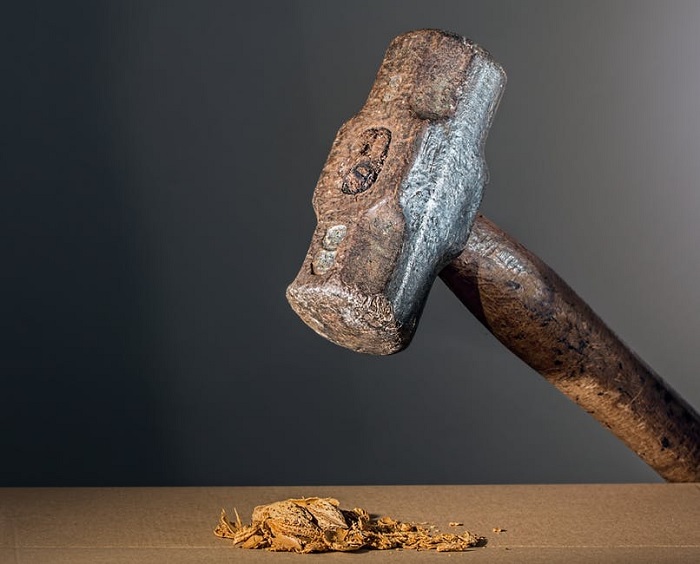 Hammer smashing nut