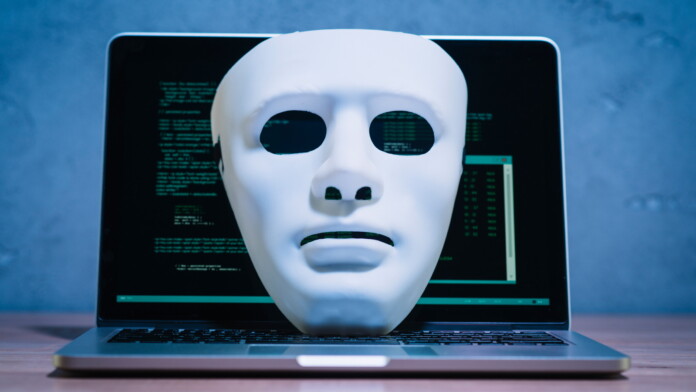 Hacker Mask on Computer