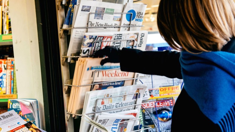 Woman Picking Newspapers
