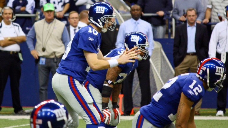 NY Giants Quarterback Eli Manning prepares to receive the snap from center during a game with the Dallas Cowboys