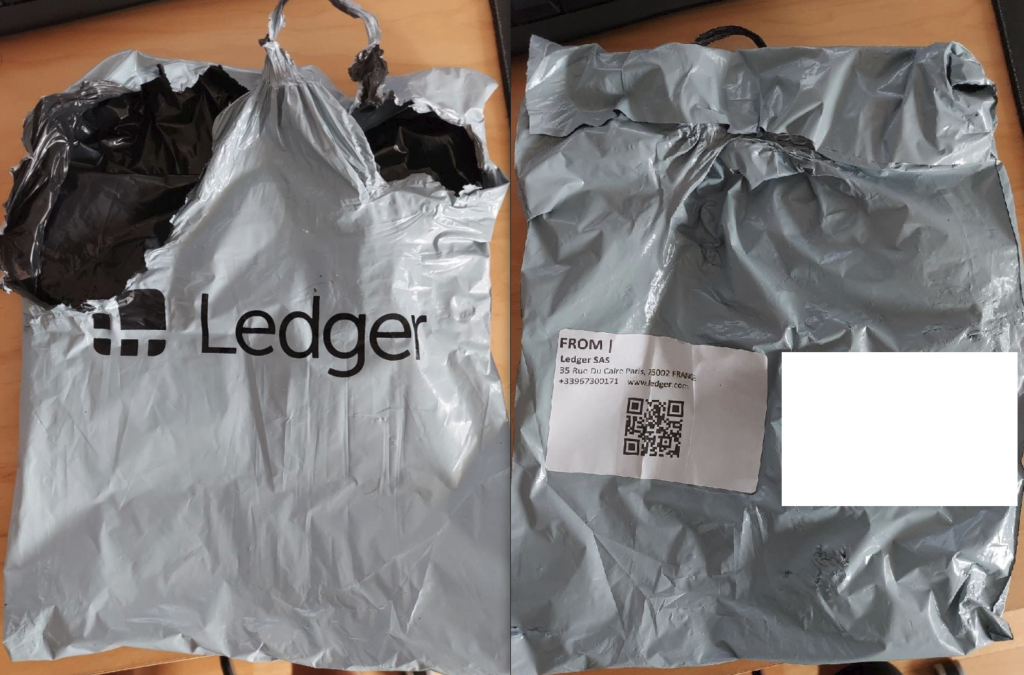 Opened parcel wrapped in Ledger-branded bags containing a shrinkwrapped USB device and a fake letter from the company's CEO Pascal Gauthier