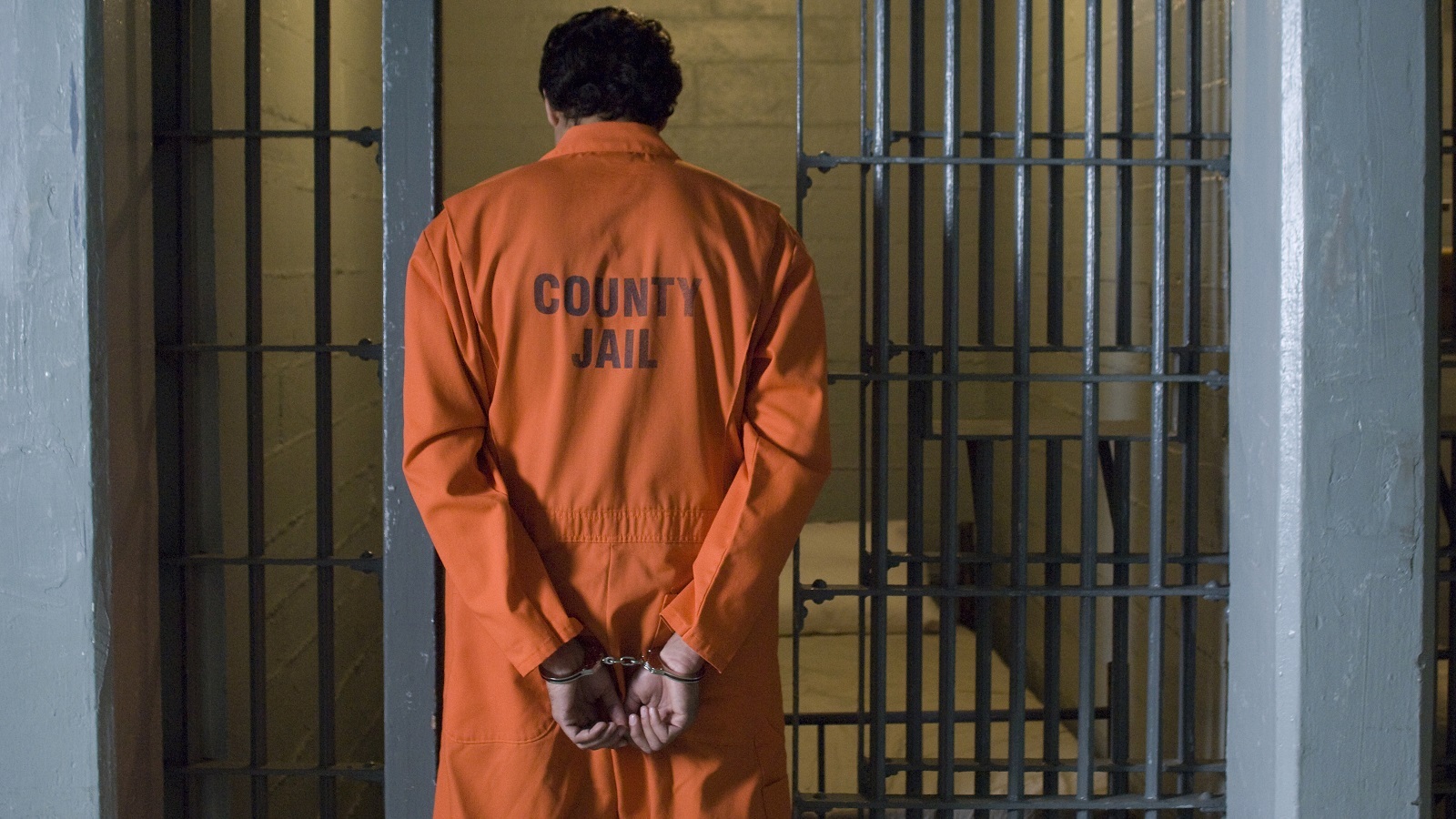 Man in handcuffs in Jail