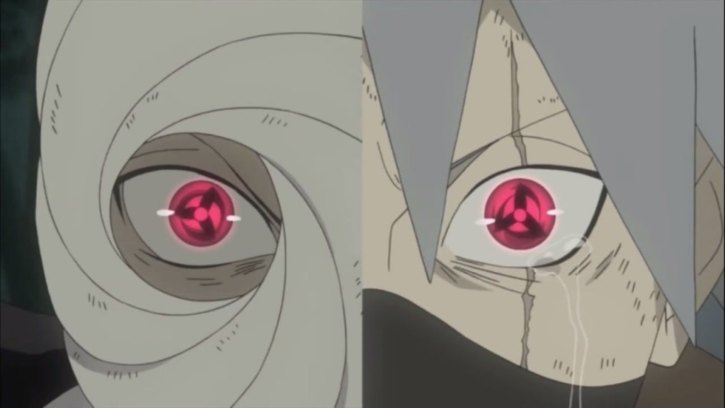 Obito awakening the Mangekyou Sharingan in his and Kakashi's eyes. 