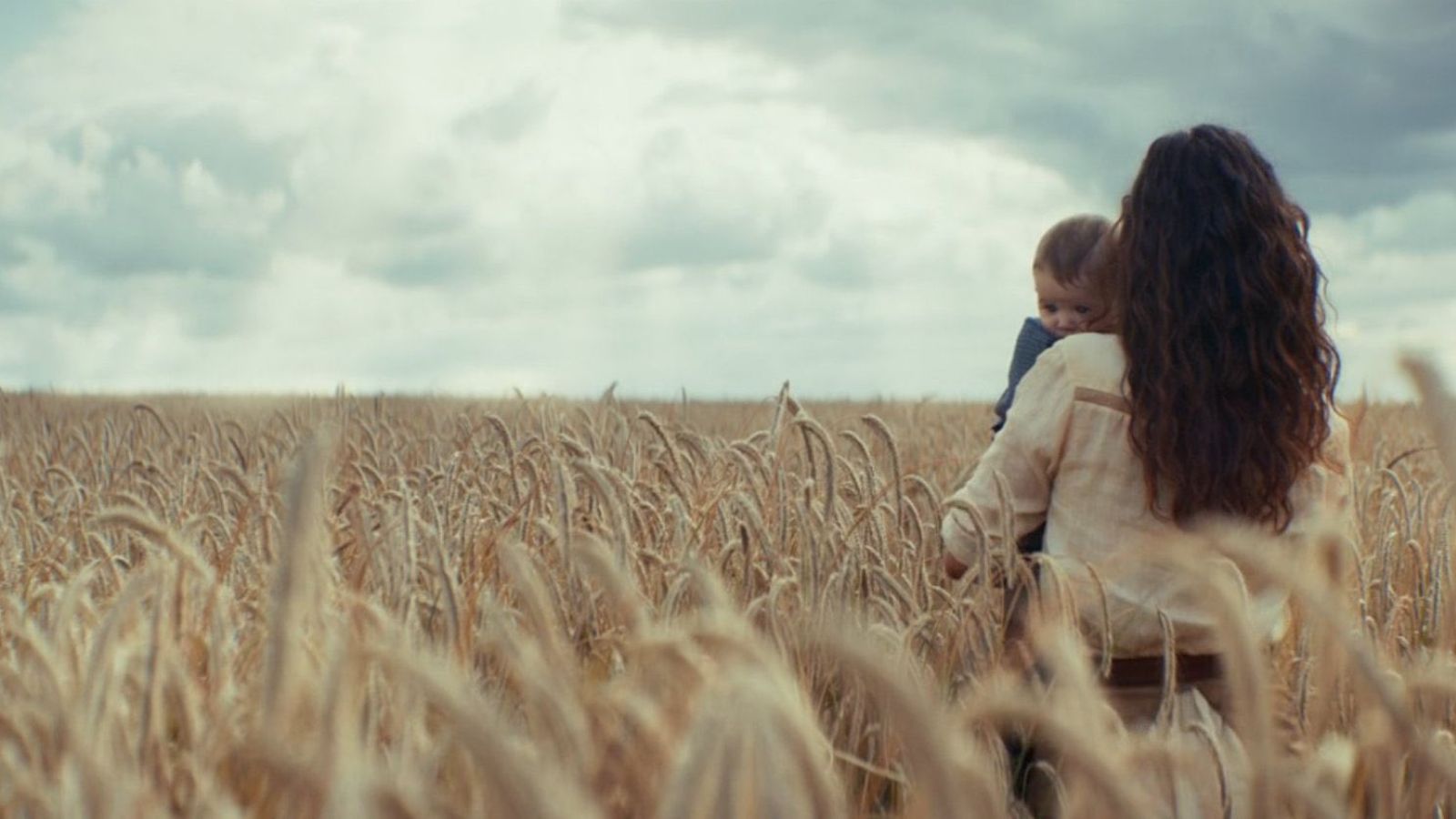 Bix holding Cassian Andor's Child