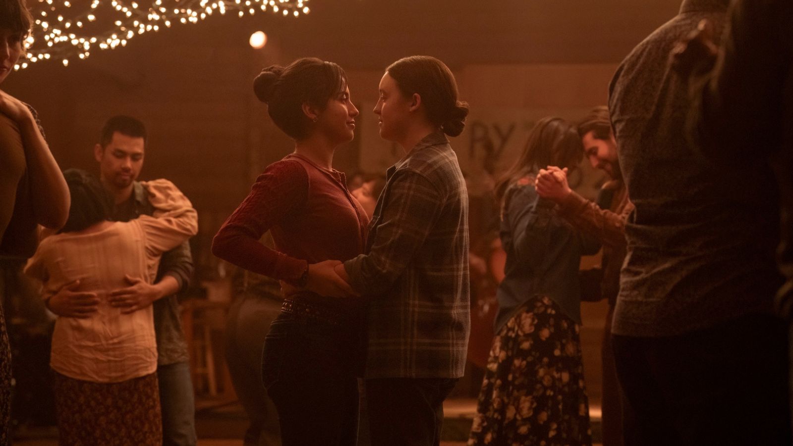 Isabela Merced as Dina and Bella Ramsey as Ellie in The Last of Us Season 2